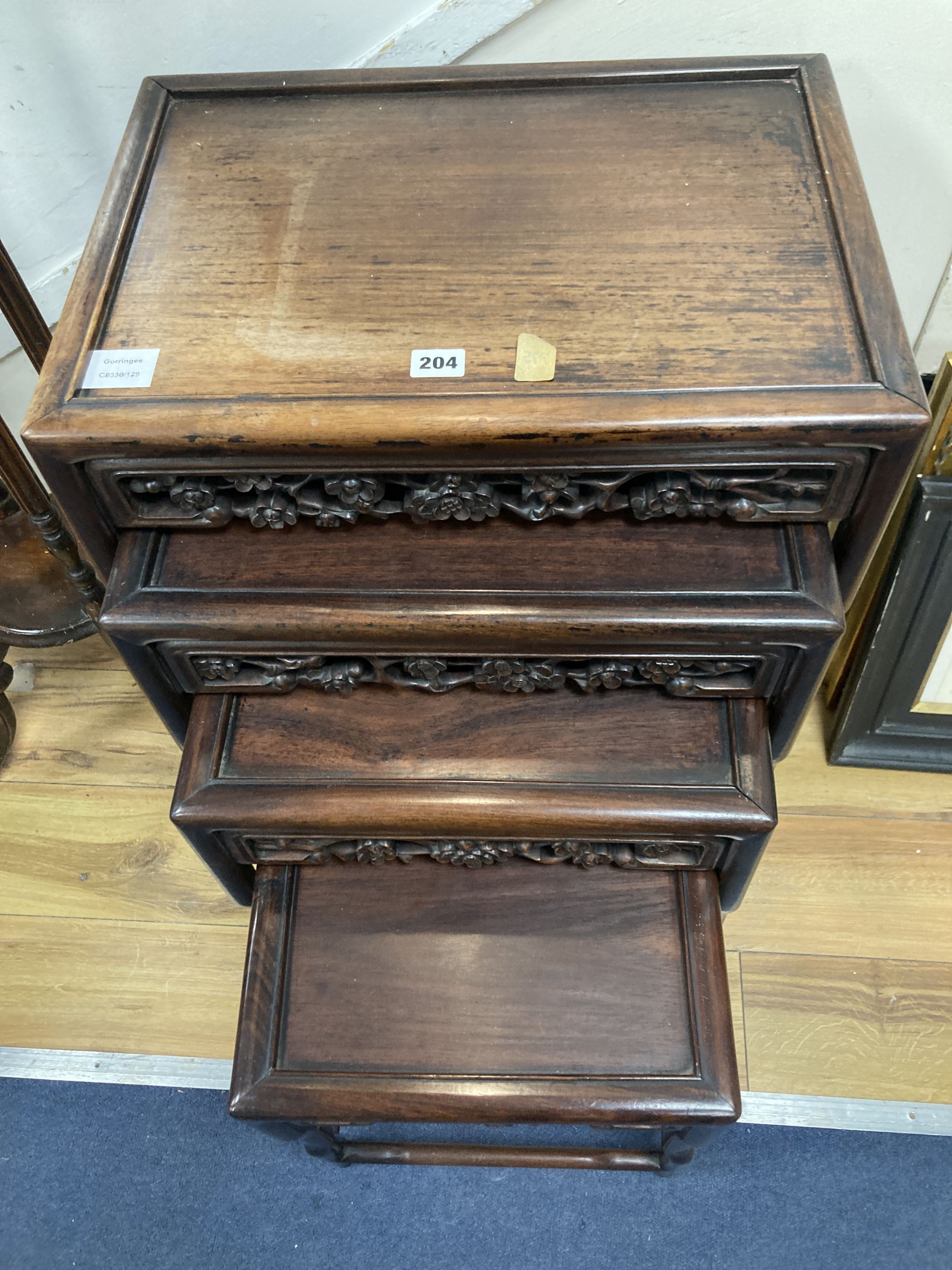 A Chinese nest of four hongmu tables, width 50cm depth 36cm height 72cm